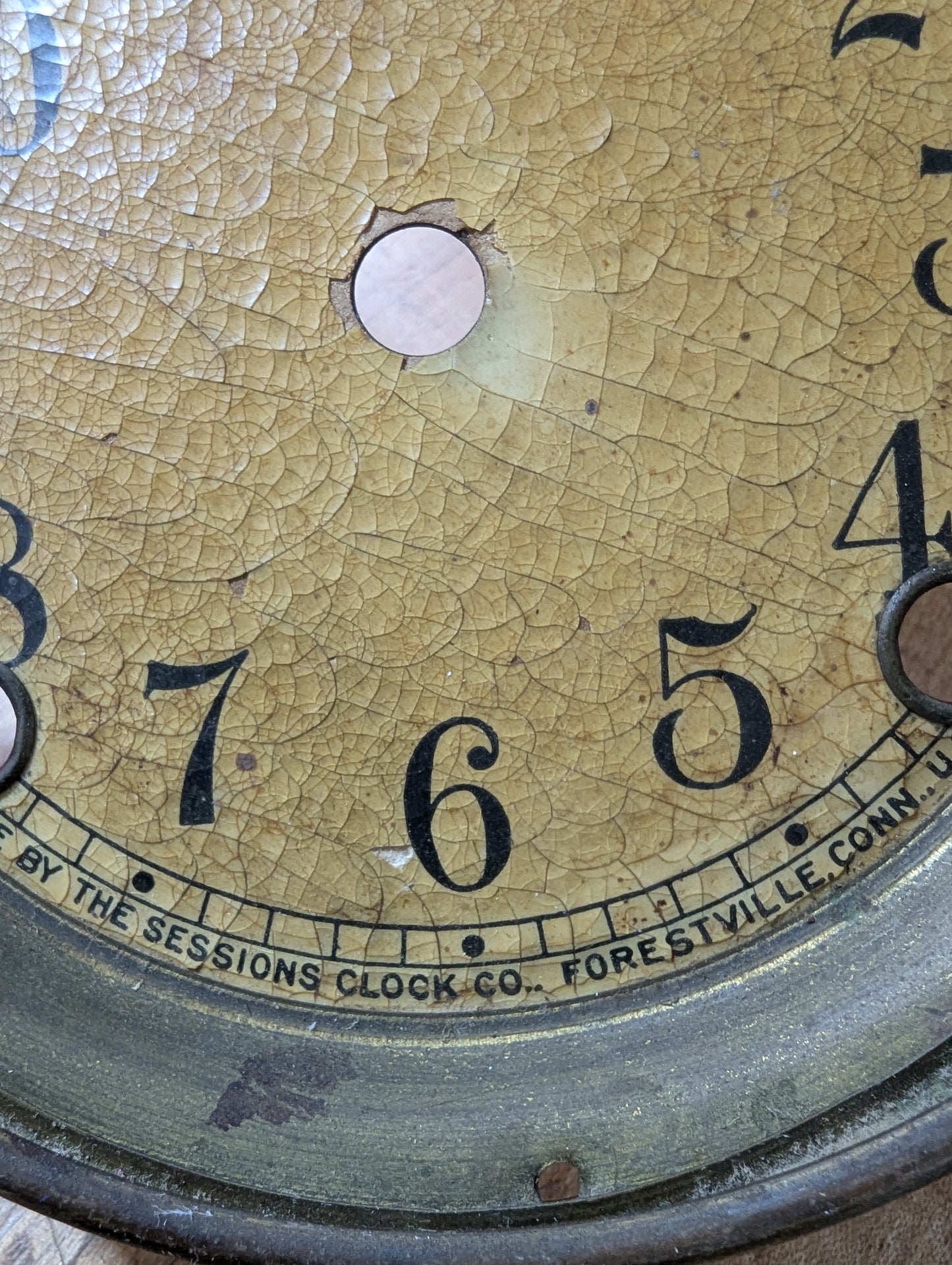 Metal clock face with glass bezel