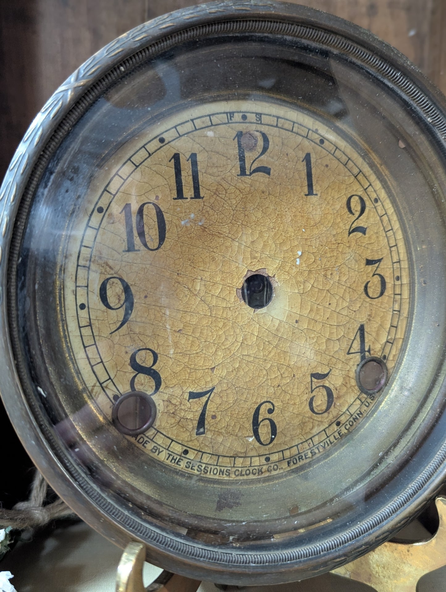 Metal clock face with glass bezel