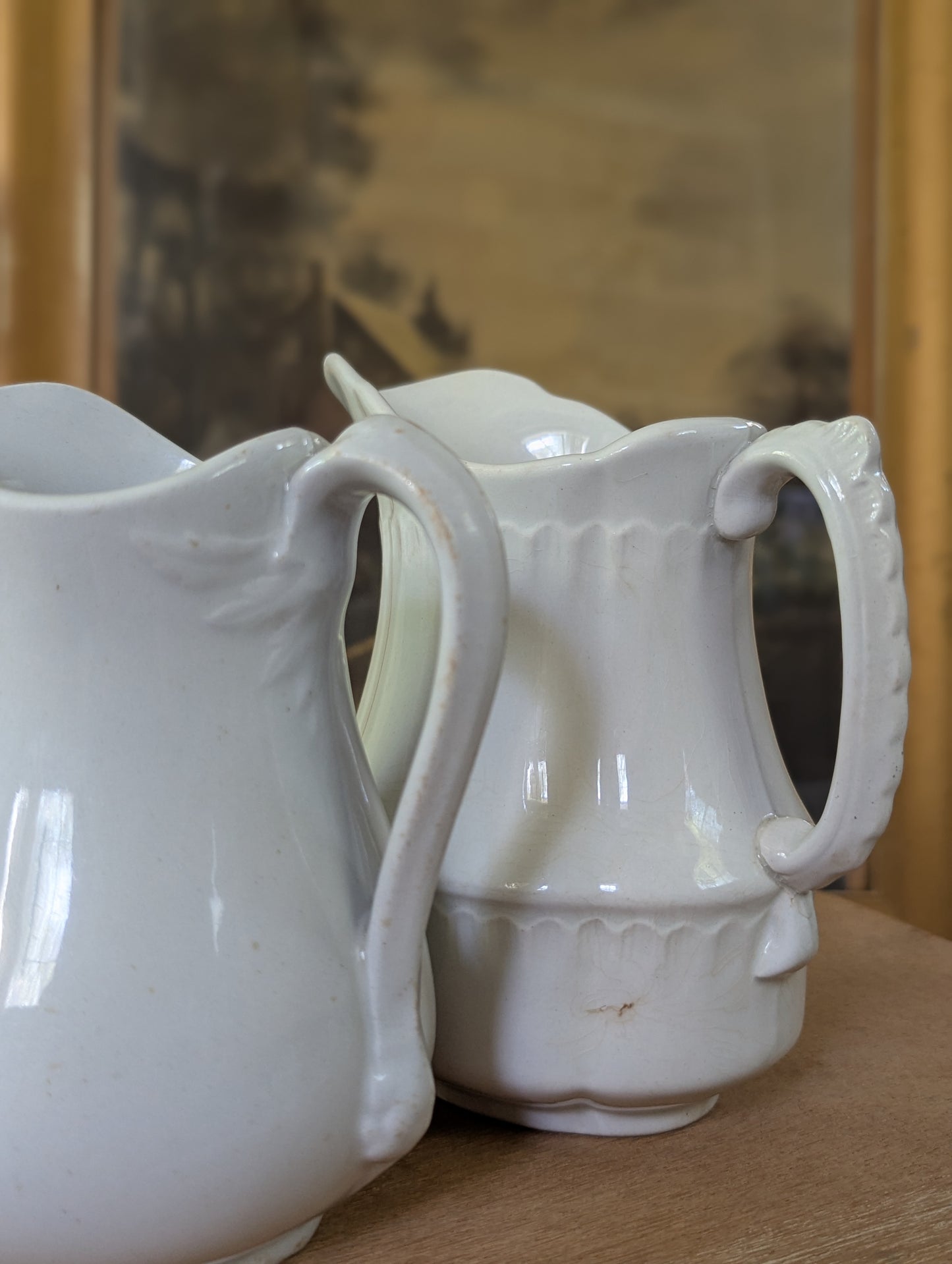 Pair of ironstone pitchers/creamers