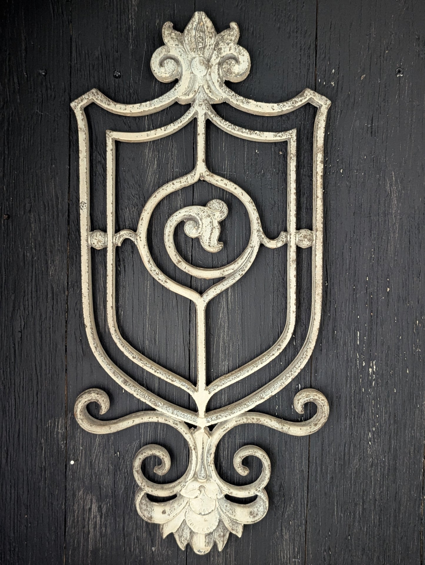 White cast metal wall decor