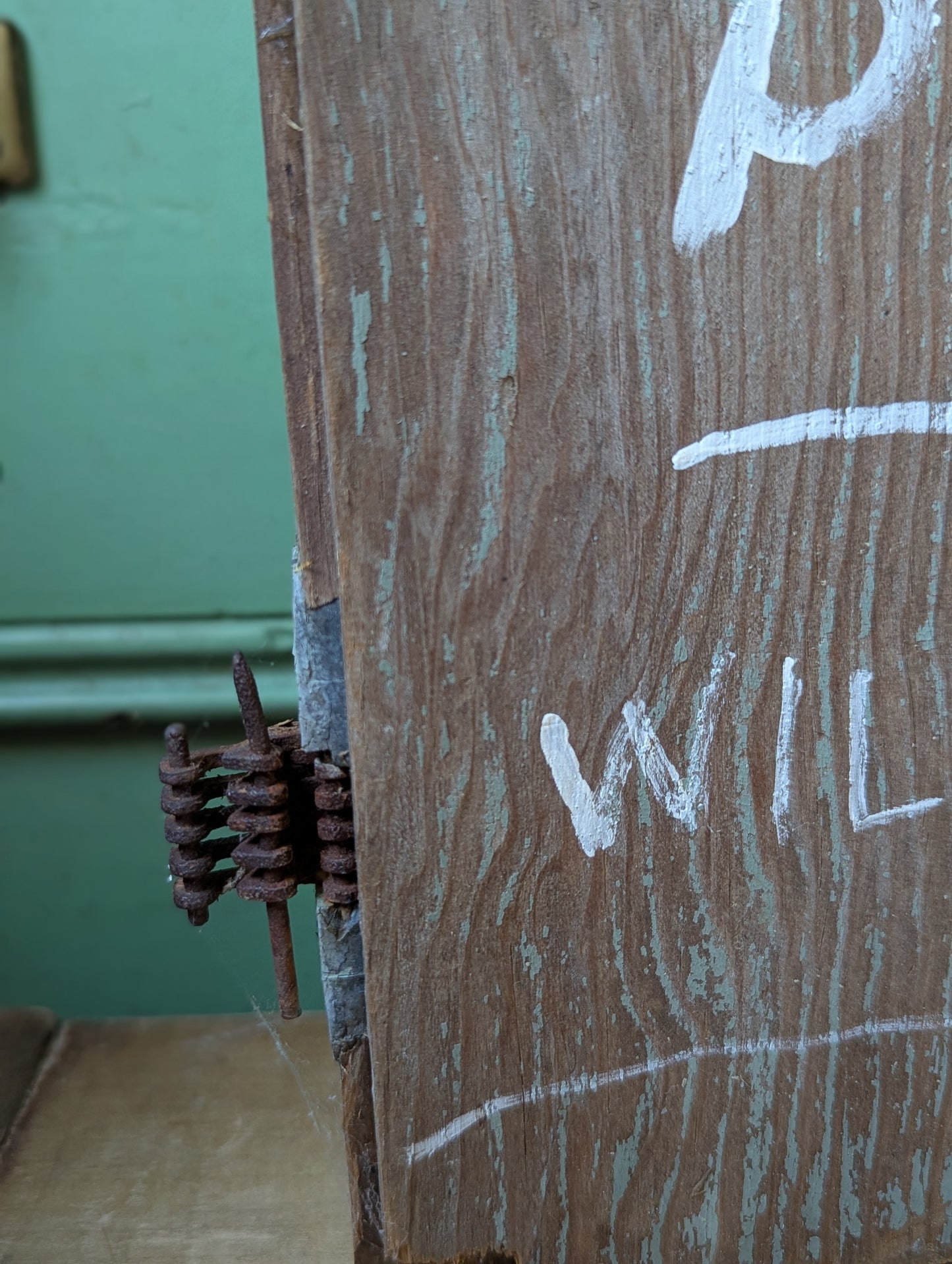 Wood door repurposed sign