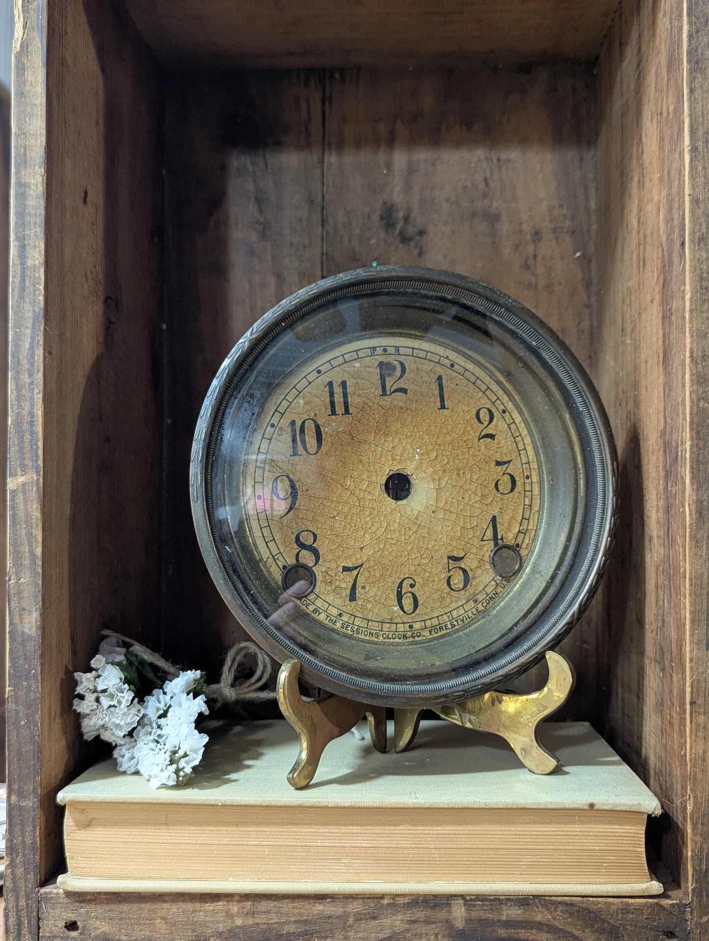 Metal clock face with glass bezel