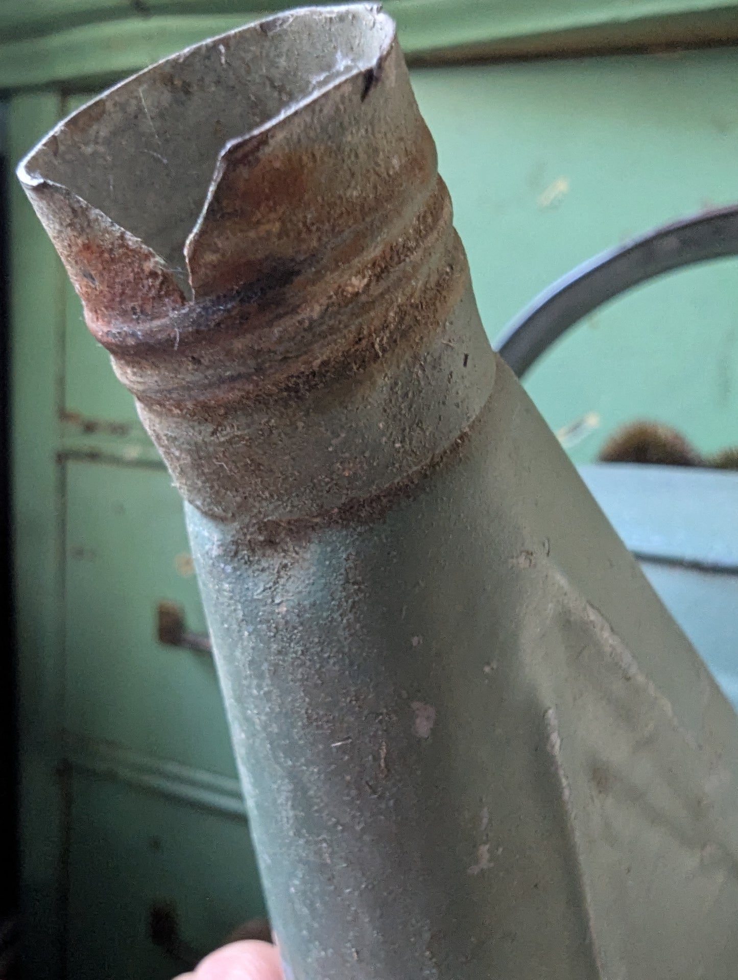 Green painted galvanized watering can