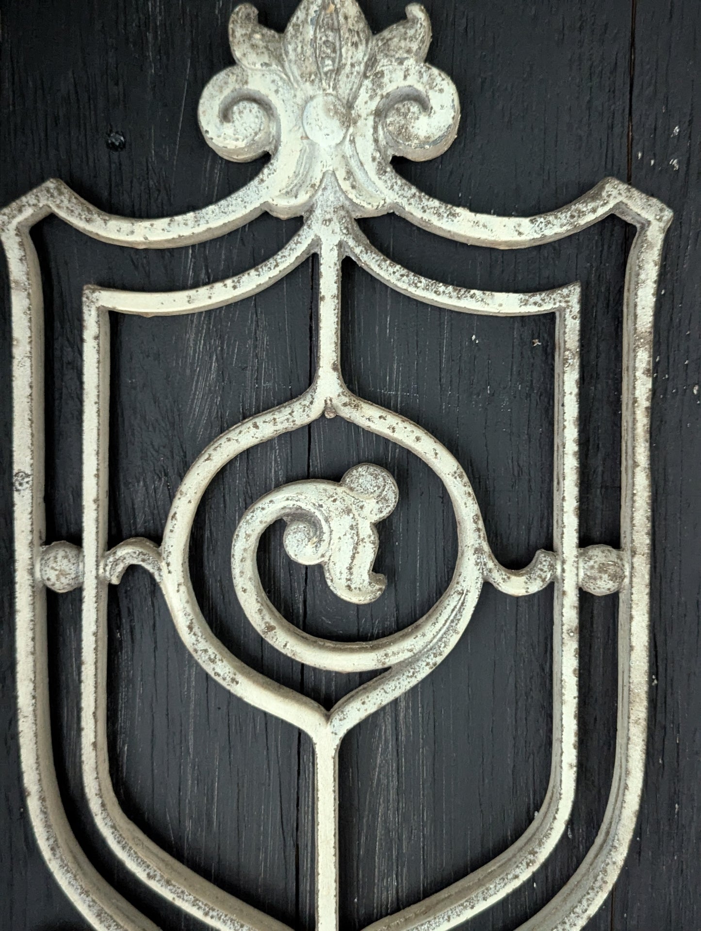 White cast metal wall decor