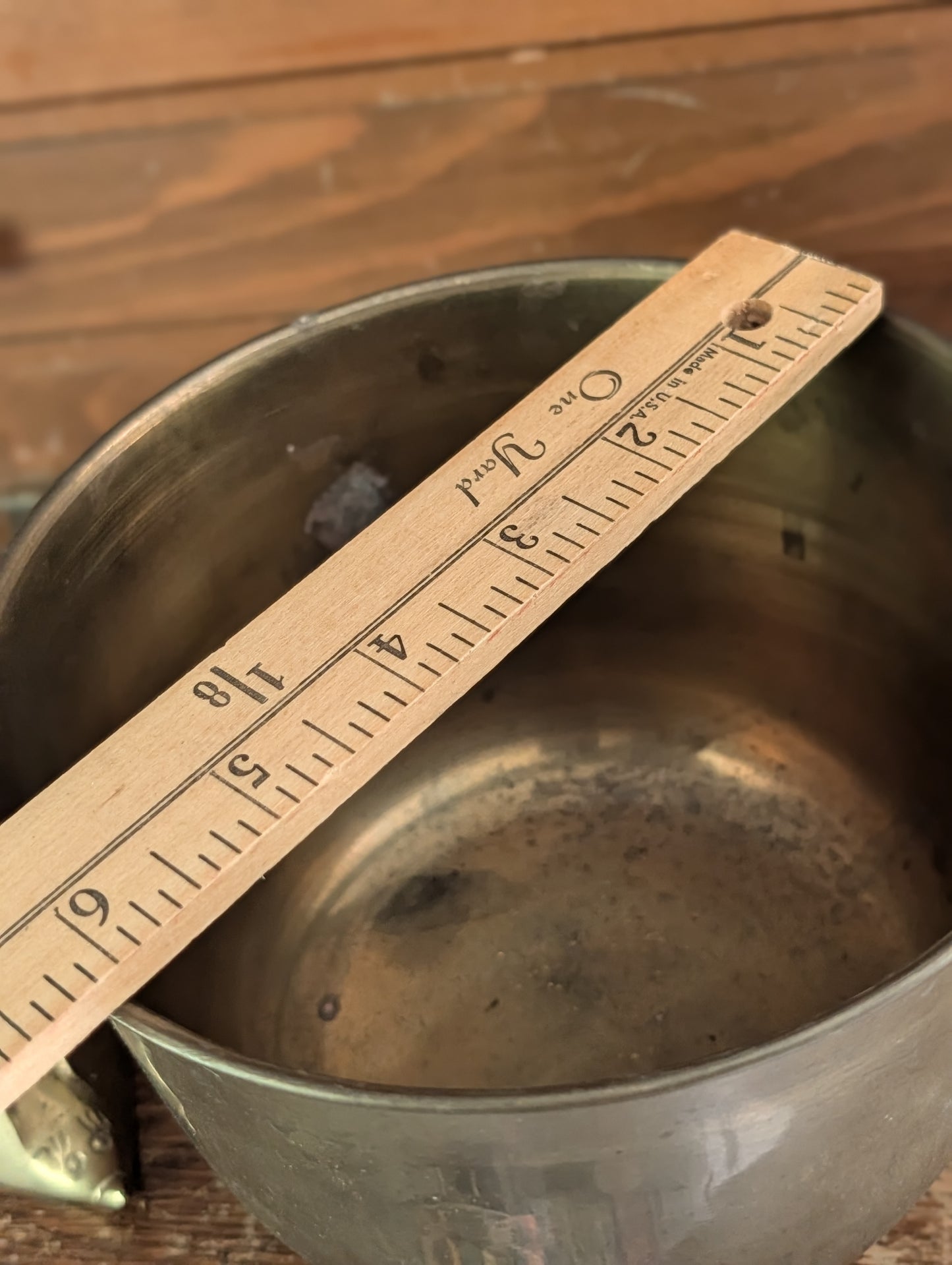 Brass footed pot