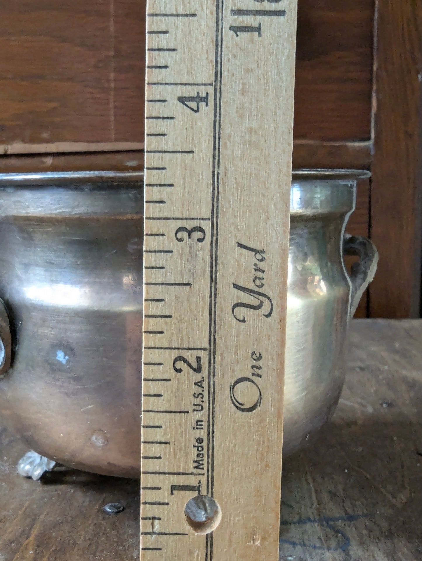 Brass footed planter pot