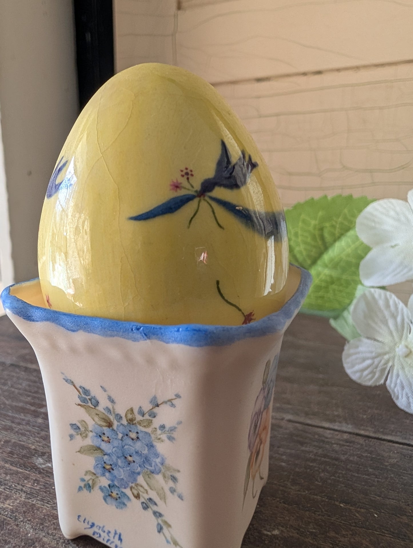 Mini pot with bluebird egg