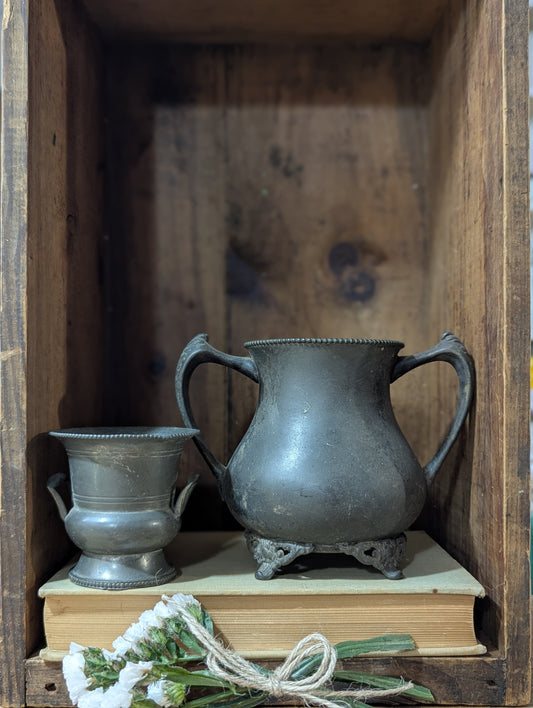 Set of two pewter urns