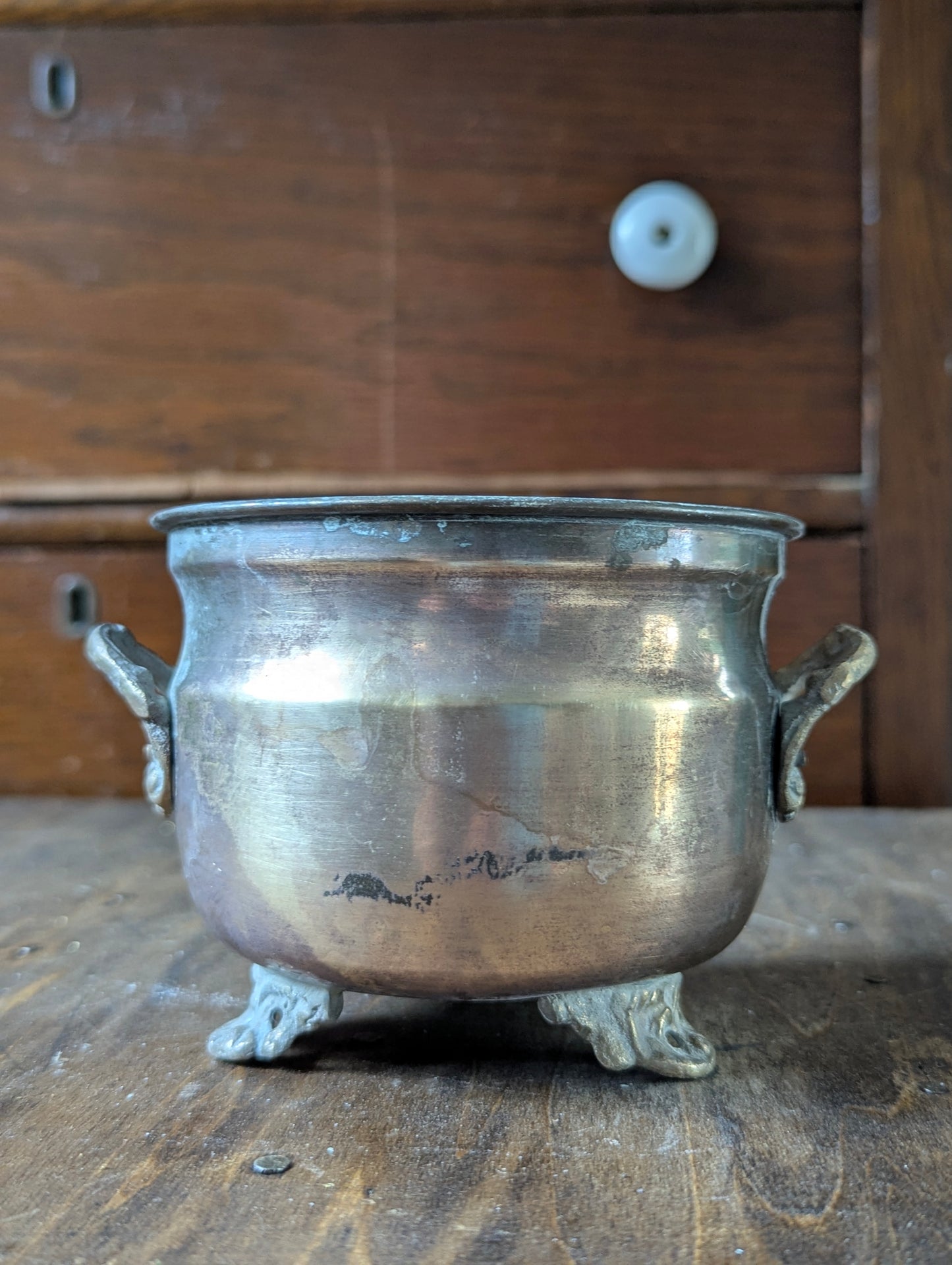 Brass footed planter pot