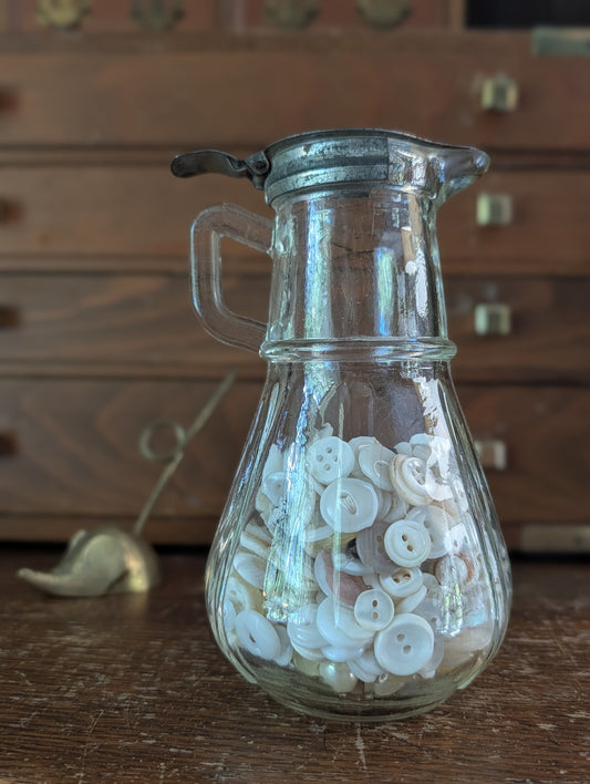 Syrup pitcher with buttons