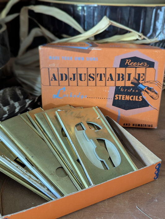 Box of Reese's  brass numbers