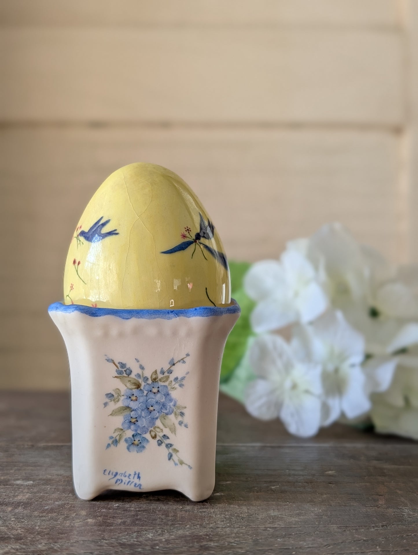 Mini pot with bluebird egg