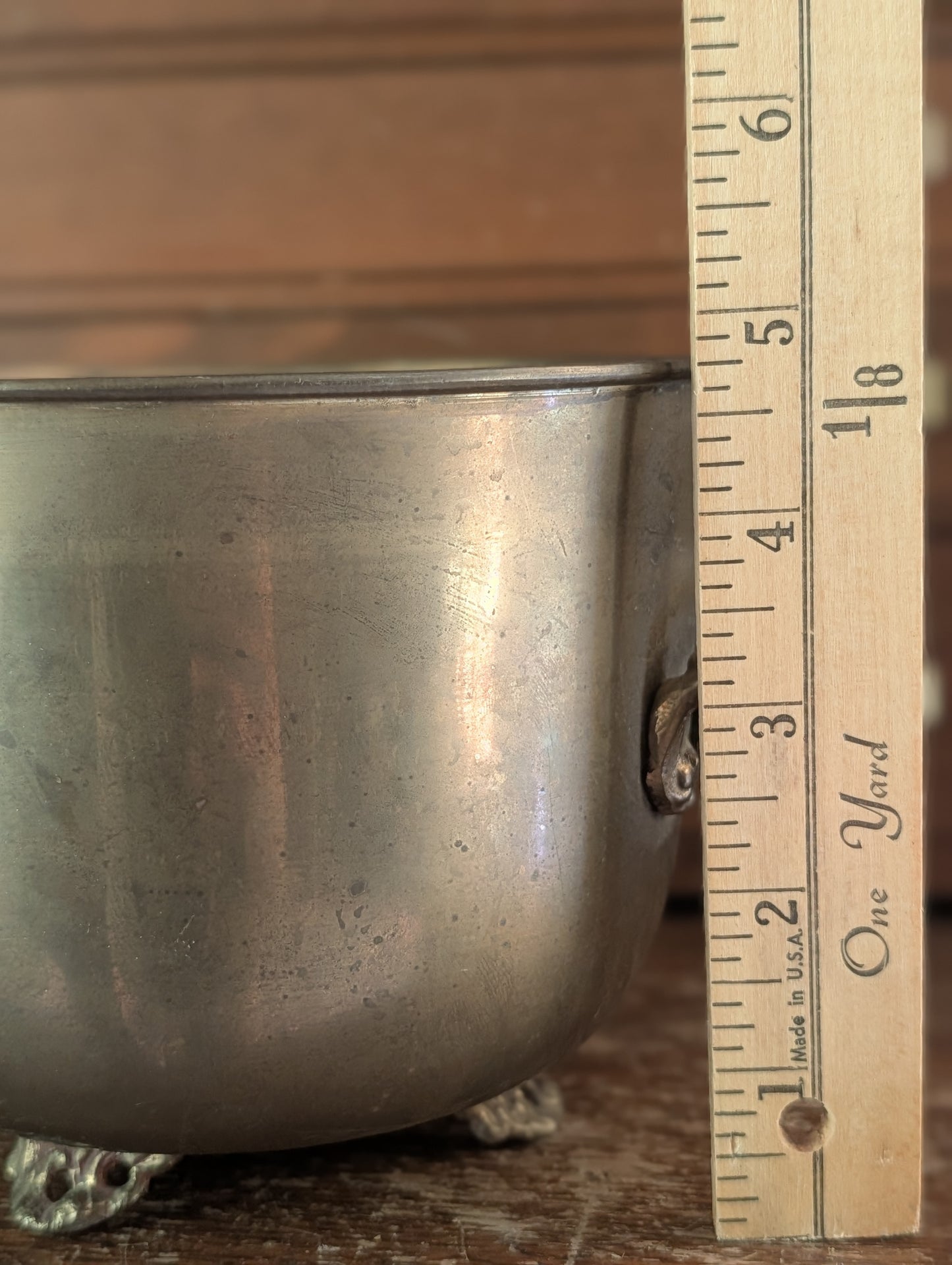 Brass footed pot
