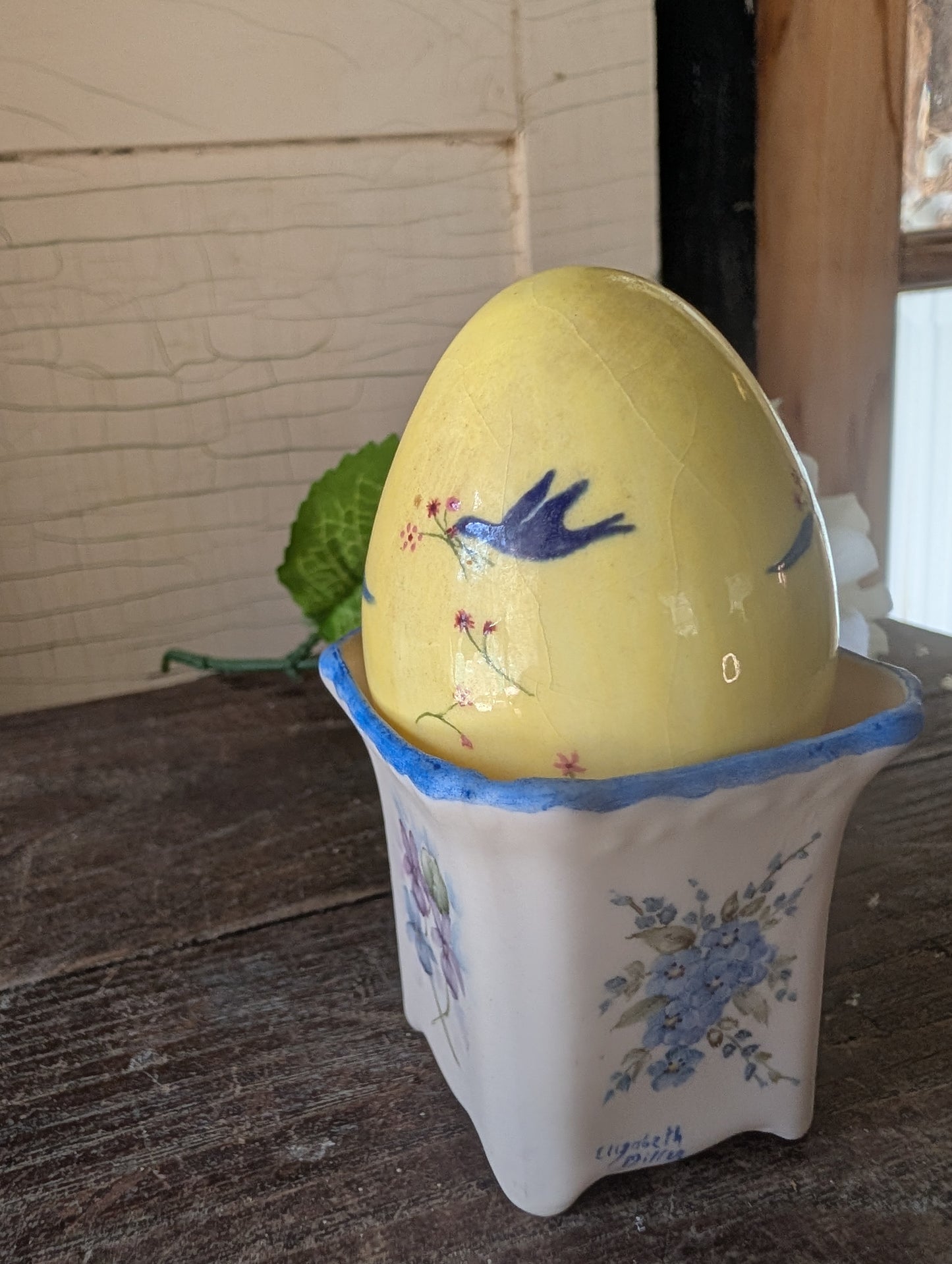 Mini pot with bluebird egg