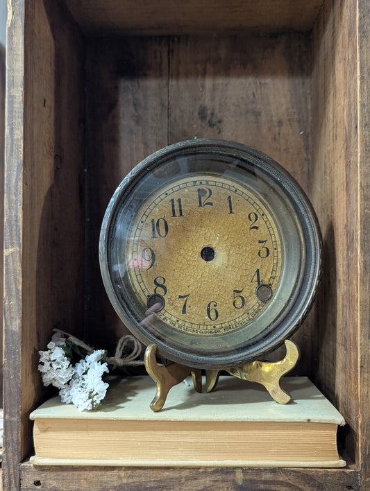 Metal clock face with glass bezel